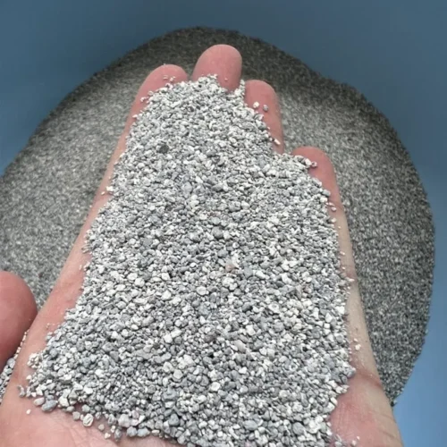 Hand Holding Fine Particle size Bentonite Cat Litter in Soft Gray by ISEMIPET Hand Holding Fine Particle size Bentonite Cat Litter in Soft Gray, by ISEMIPET