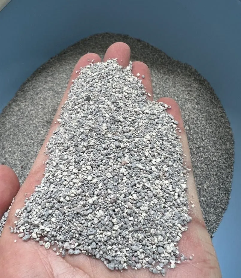 Hand Holding Fine Particle size Bentonite Cat Litter in Soft Gray by ISEMIPET Hand Holding Fine Particle size Bentonite Cat Litter in Soft Gray, by ISEMIPET