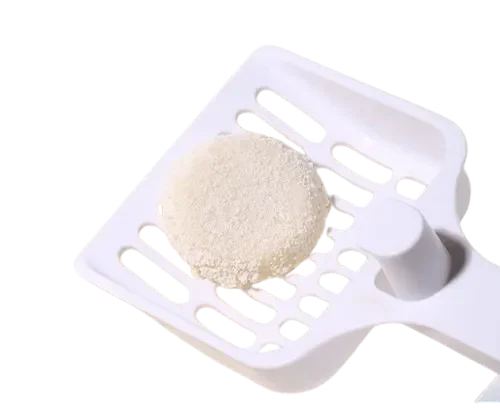 Clumped Cassava Tofu Cat Litter on White Plastic Scoop by ISEMIPET