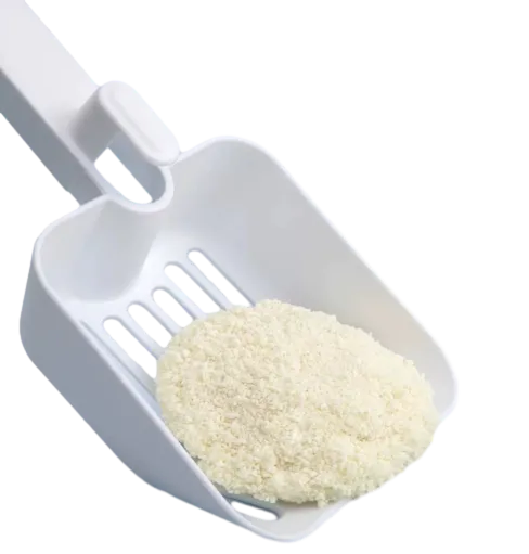 Scooping Cassava Cat Litter Granular View by Isemipet Isemipet Close up of Cassava Cat Litter in Plastic Scoop