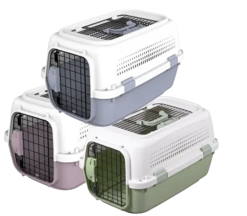 Stack of three hard-shell pet carriers in multiple colors